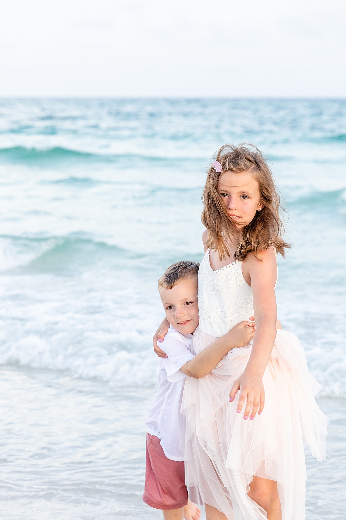 Brother and sister by in the ocean | Pensacola Beach extended family session by Pensacola Florida photographer Hannah Hillis Photography