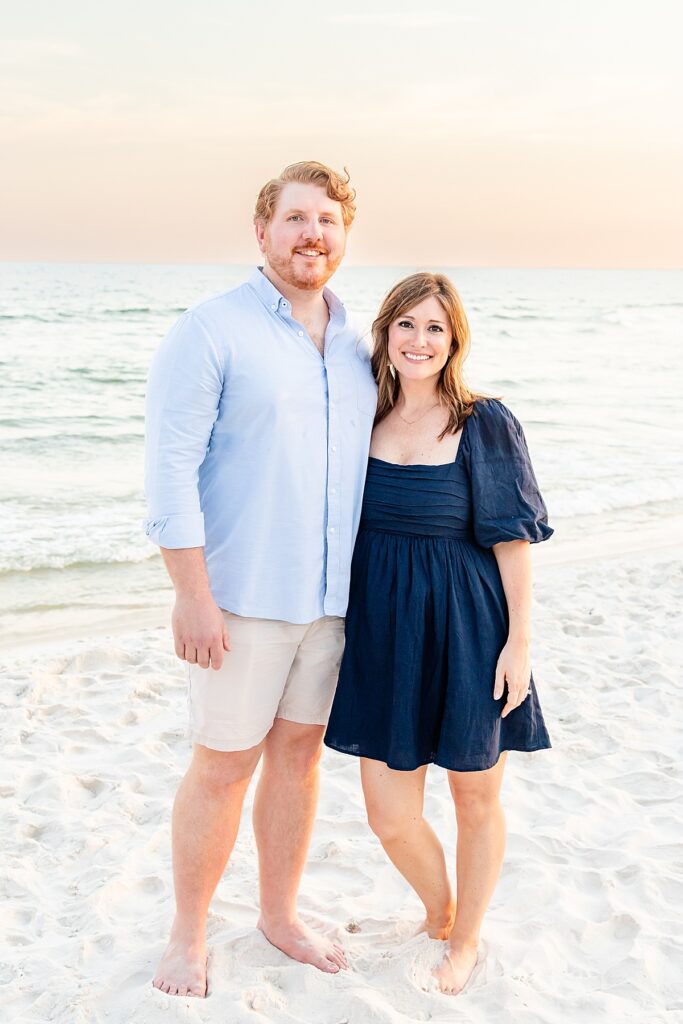 couple by the water during extended family session in pensacola fl