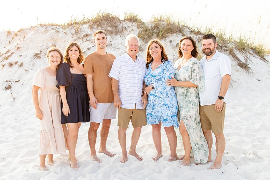 family photo of parents with their kids on pensacola beach during extended family session