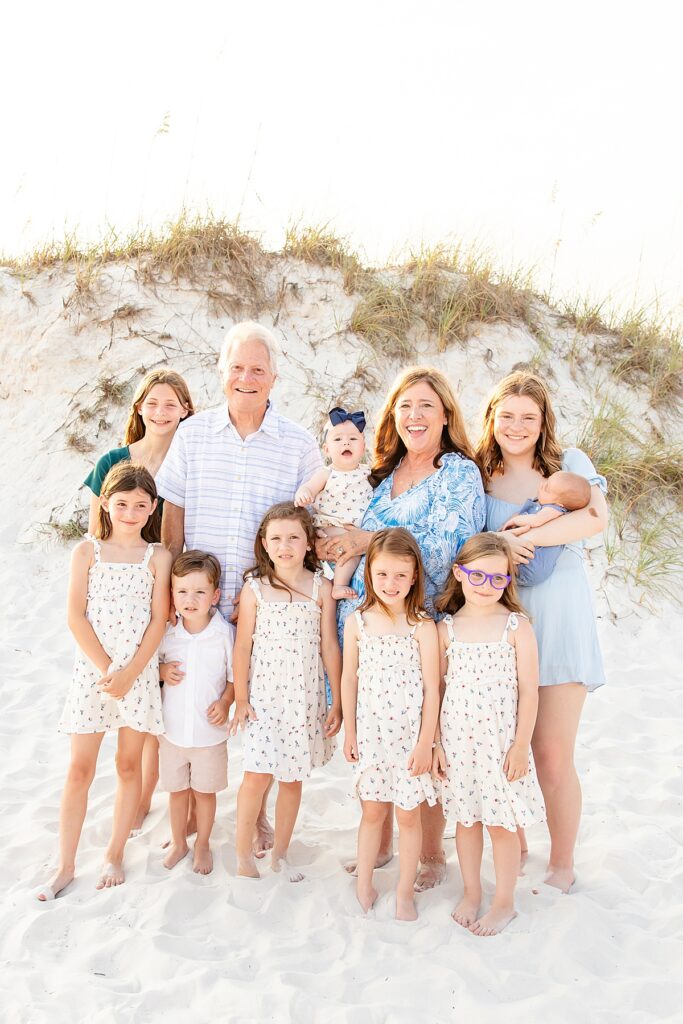 family photo of grandparents with the grandkids on pensacola beach during extended family session